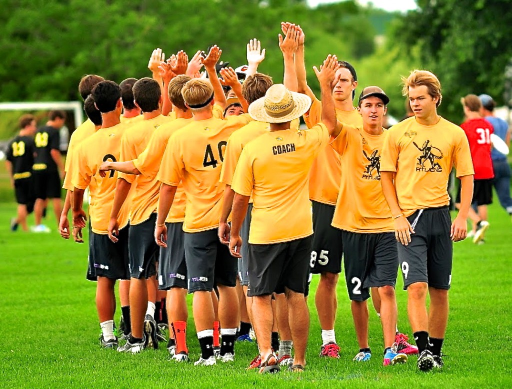 Team high fives after an opening round victory. Photo courtesy Rob Brownell.