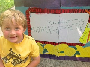 Lemonade stand proprietor Bennett Kane flashes his famous toothless smile while sharing his menu with the media.