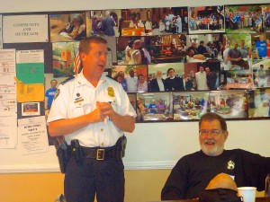 APD Captain Brent Schierbaum makes a point to the group while John Wolfinger listens.
