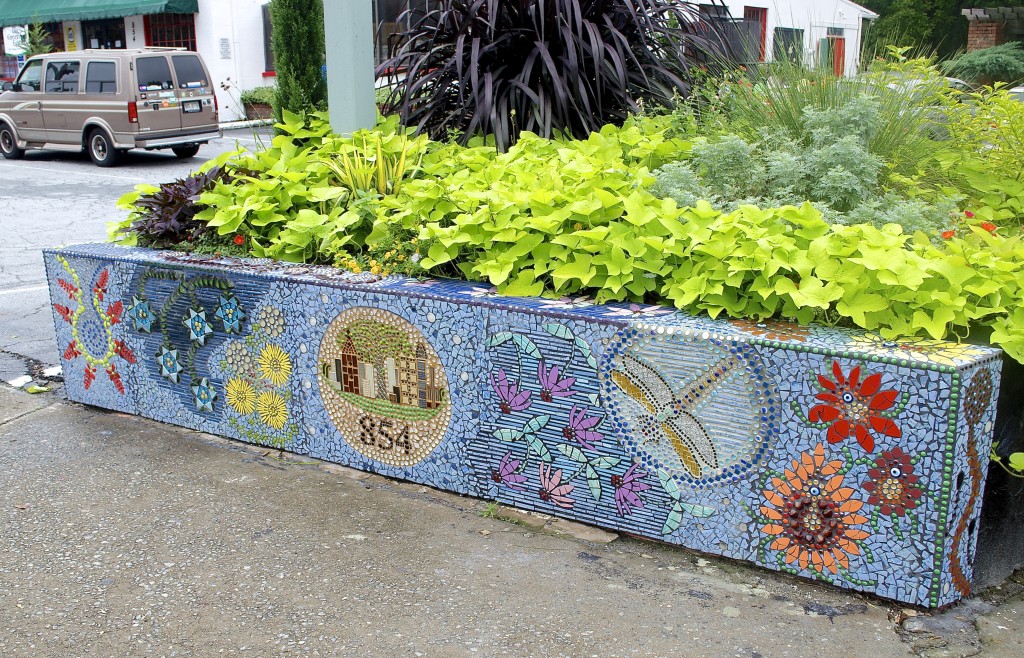 Coffin's newest mosaic - Atlanta Afloat - adorns the wall of the Intown Ace Hardware planter that faces N. Highland Ave.