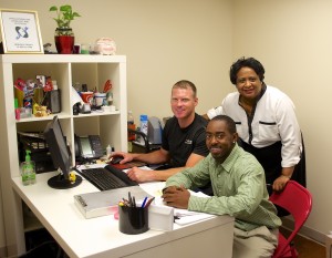 Briarcliff Summit property manager Annie Copeland (right) with relocation coordinator Brandon Copeland (front) and technician Brian Arterburn 