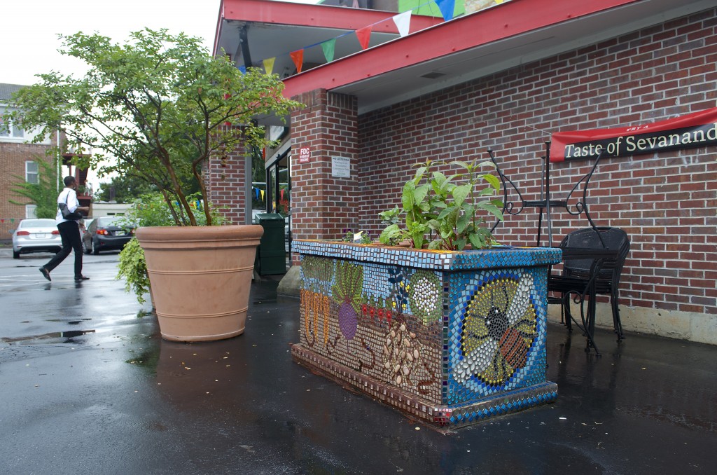 Coffin created a 4-sided mosaic for this planter outside the front door at Sevananda in L5P. View our photo album (link below) for photos of the other three sides.