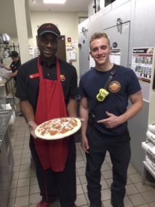 Fireman Mike poses with the specialty pie that now bears his name.