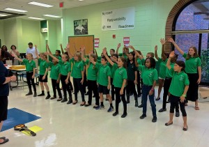 The SPARK Advanced Chorus performed before the meeting.