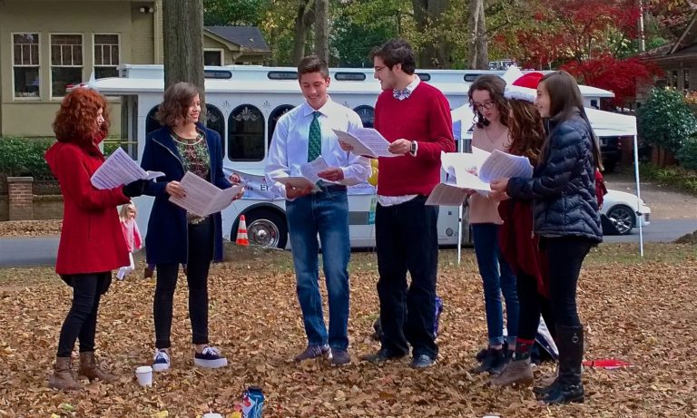 Carolers from Grady High School entertained tour-goers.